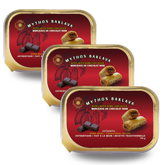 Three tins of Mythos Baklava with red labels and gold borders on a white background. Dark Chocolate flavor